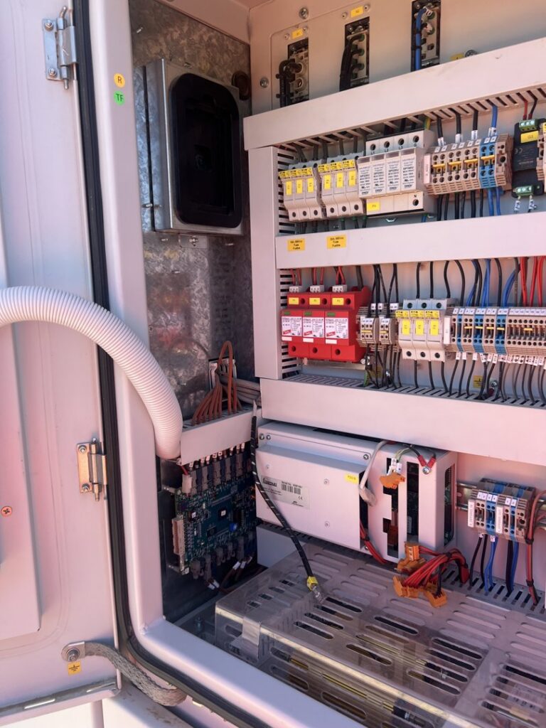 An open electrical control panel showing circuit breakers and wiring by Sparrow Electric, LLC in Denver, CO.