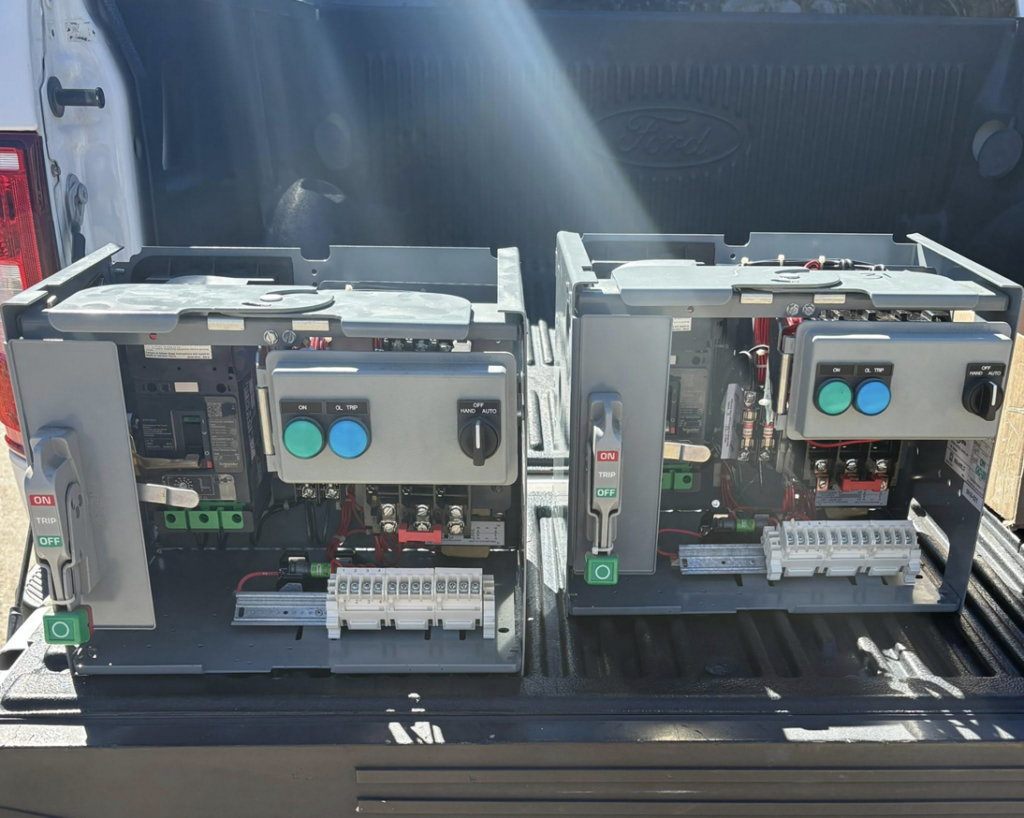 Two electrical control panels in a pickup truck bed for Prescott Electric Service in Hattiesburg, MS.