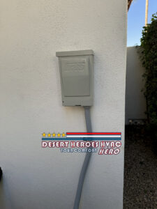 An electrical disconnect box for an outdoor AC unit, installed by Desert Heroes HVAC in Phoenix, AZ