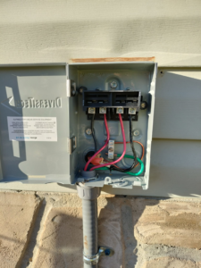 An open electrical disconnect box with new wiring installed by Devin Parker Electric in Knoxville, TN