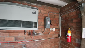 Electrical disconnect switch and conduit installation on a brick wall by Triumph Electrical Services, Inc in Minneapolis, MN