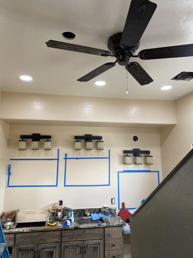 New electrical fixture installation, including a ceiling fan, recessed lights, and wall sconces, by Sahuaro Electric LLC in Tucson, AZ.