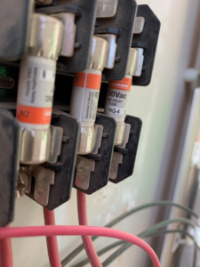 A close-up view of electrical fuses and wiring, showcasing work by Grason Electric in Fort Collins, CO.