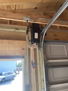 Electrical installation with conduit and wiring for a garage door opener by Diaz Techician LLC in Chicago, IL.
