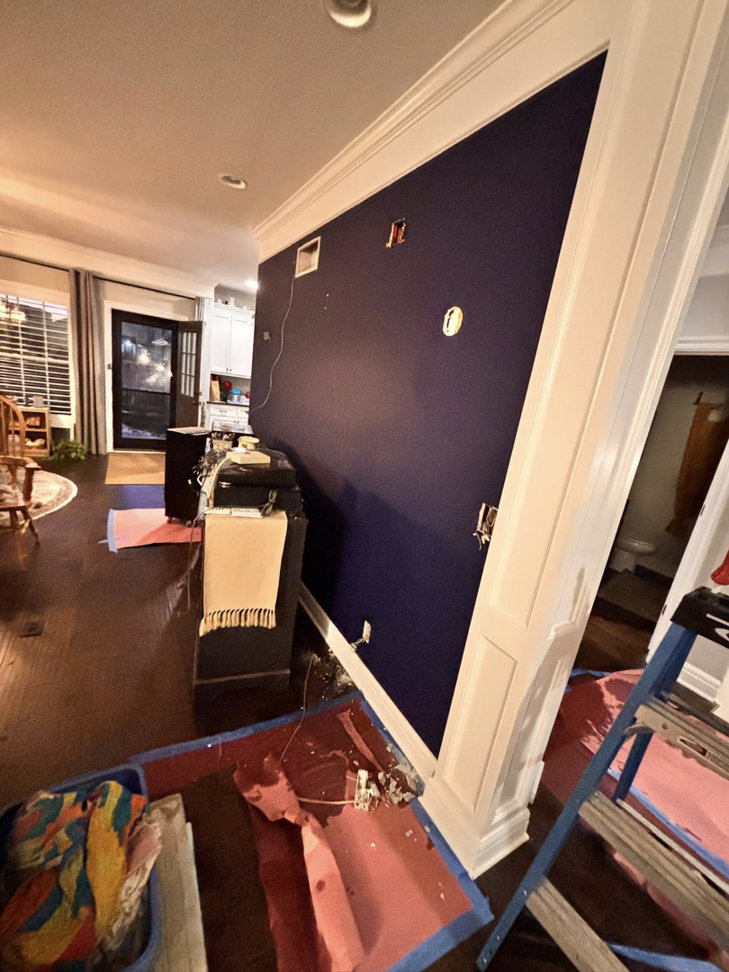 An electrician's work in progress, showing wall cutouts for electrical installations by 3 Phase KC in Independence, MO.