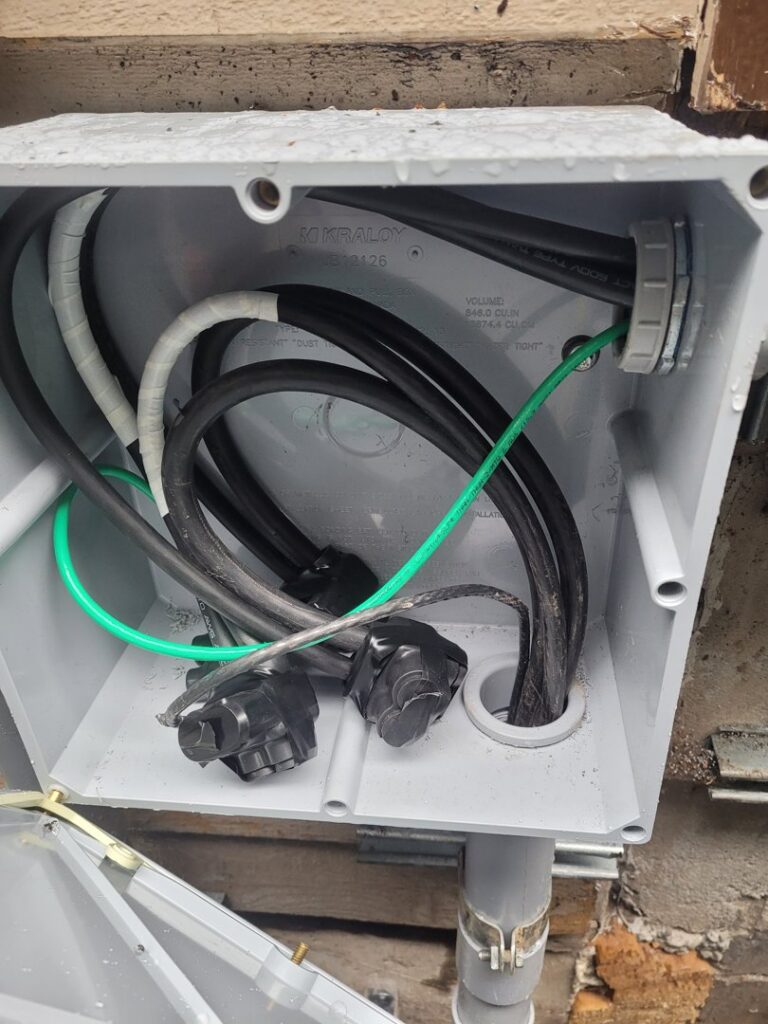 Electrical wiring and grounding inside a junction box installed by Ant Power Electric in Tacoma, WA.