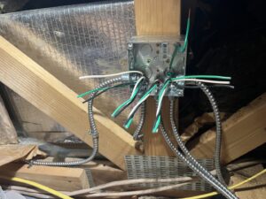 An open electrical junction box with wiring and conduit installed by Sparrow Electric, LLC in Denver, CO.