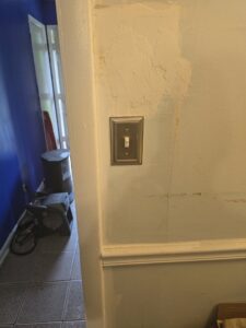 A newly installed electrical light switch on a wall, representing work by Mr. Electric of Montgomery County Alabama in Montgomery, AL.