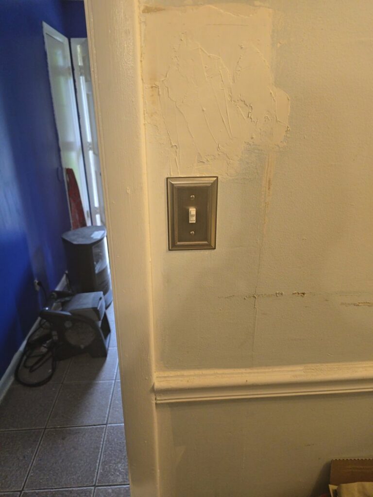 A newly installed electrical light switch on a wall, representing work by Mr. Electric of Montgomery County Alabama in Montgomery, AL.