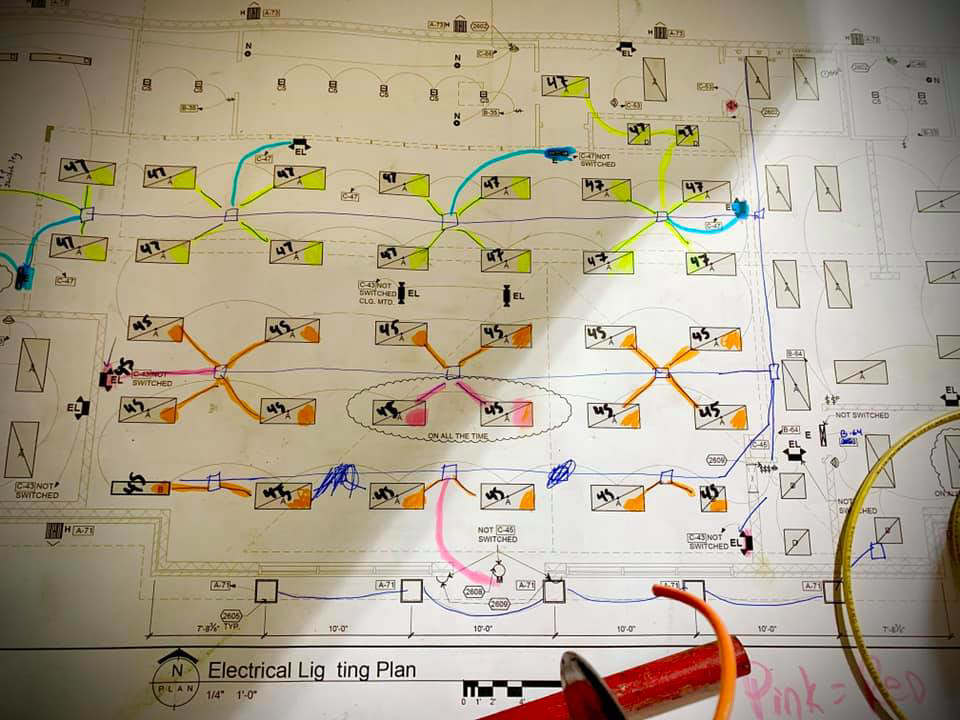 An electrical lighting plan blueprint with notes and markings used by Lightningwerks Electrical in Springfield, MO.