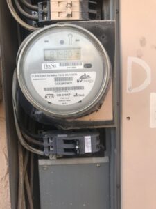 A close-up of an NV Energy electrical meter and wiring components by Neptune Electric LLC in Las Vegas, NV