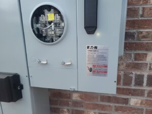 An outdoor electrical meter base and main disconnect panel installation by TOTAL Electric LLC in Fayetteville, NC.