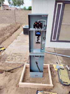 An electrical meter base and open panel installation in progress by Johnson Power and Air in Gilbert, AZ.