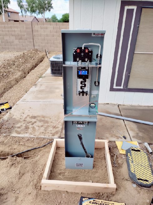 An electrical meter base and open panel installation in progress by Johnson Power and Air in Gilbert, AZ.
