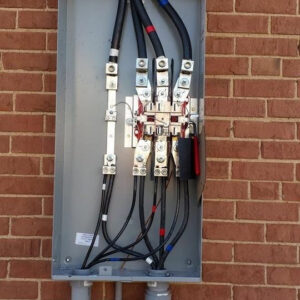 An open electrical meter base with heavy-duty service cables connected, demonstrating electrical installation by GOBE LLC in Columbia, MO.