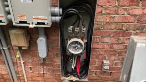 Close-up of electrical meter base wiring during an installation by Oak Electric LLC in Waterford, MI.
