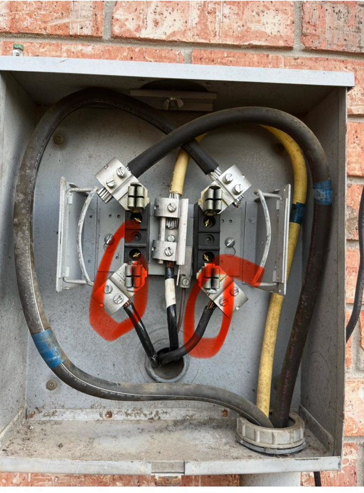 Close-up view of electrical meter base wiring and connections by Tony James Electrical service in Houma, LA.