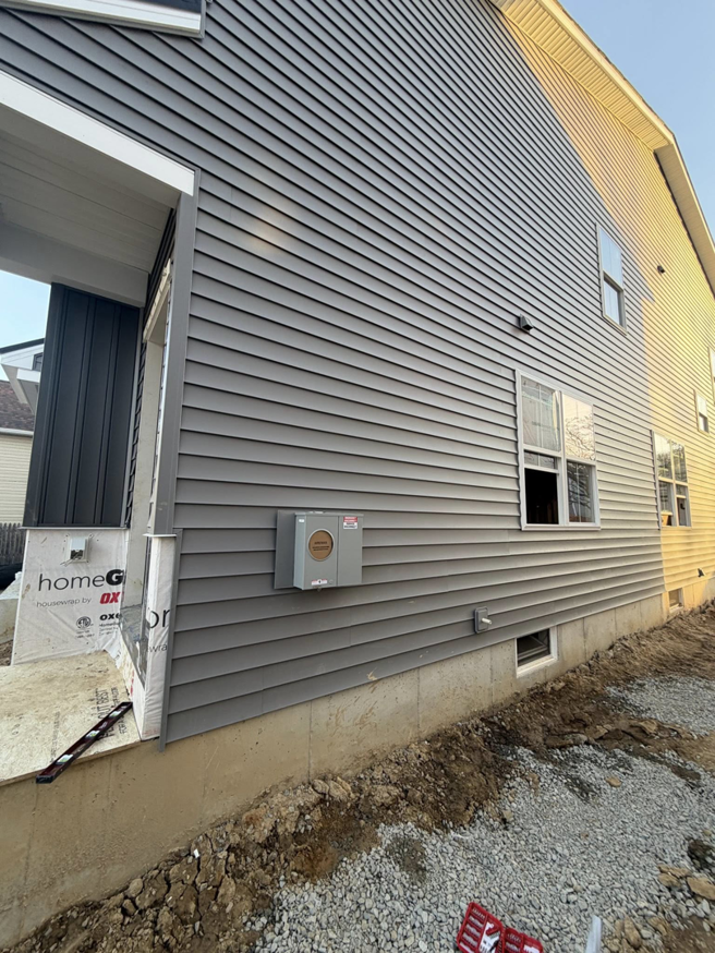 An electrical meter box installed on the exterior of a new construction home by Mark Anthony Electric LLC in Wilmington, DE