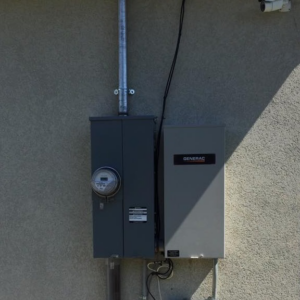 An electrical meter and Generac generator transfer switch installed by Live Wire Service in Salt Lake City, UT.
