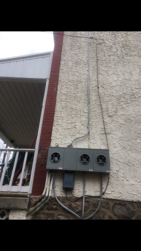 New electrical meter installation on the exterior of a building by John Fean Electrician Inc. in Philadelphia, PA.