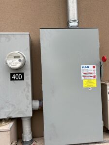 Exterior view of an electrical meter and main service panel installed by Justin Benevage Electrical, LLC in Lake Charles, LA