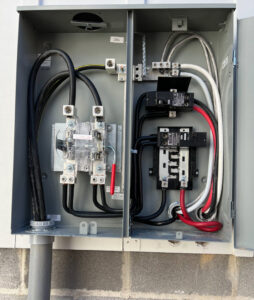 An open electrical meter panel showing wiring and breakers installed by Raschke & Sons Electric in Chattanooga, TN