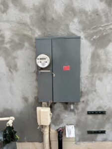 An outdoor electrical meter and service panel installed by HomeRun Electric LLC in Arlington, TX