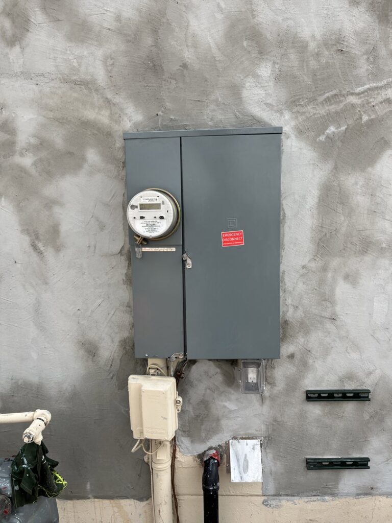 An outdoor electrical meter and service panel installed by HomeRun Electric LLC in Arlington, TX