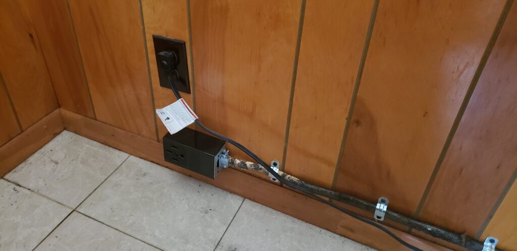 Electrical outlet and conduit installation on a wooden wall by Allied Electric Company of Minnesota in Minneapolis, MN