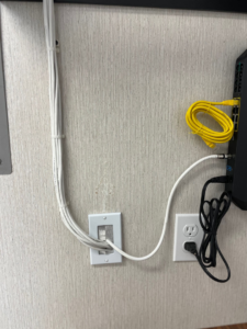 An electrical outlet and data port wall plate installation by One Installation Inc. in Davie, FL