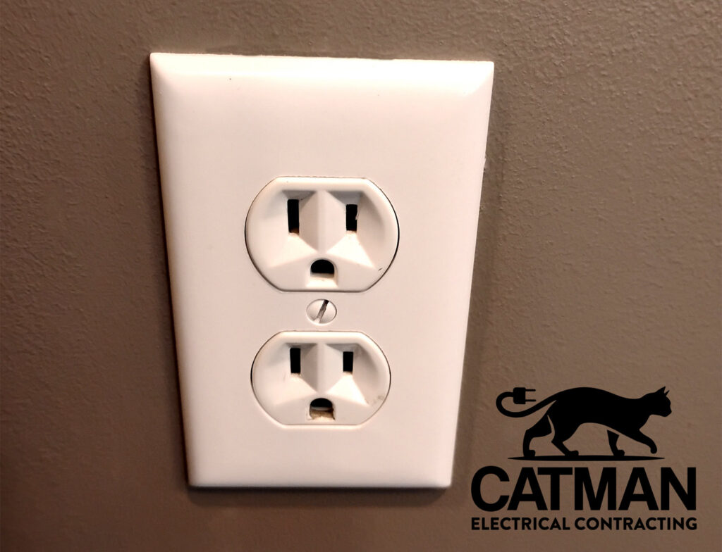 A standard electrical outlet installed on a wall, showcasing work by Catman Electrical Contracting in Dallas, PA.