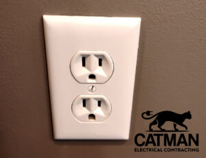 A standard electrical outlet installed on a wall, showcasing work by Catman Electrical Contracting in Dallas, PA.