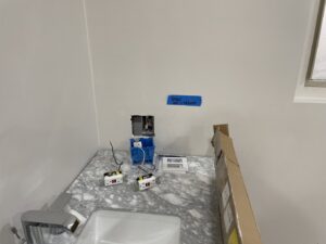 New electrical outlets and switches ready for installation in a bathroom by MCM Electrical Services LLC in Phoenix, AZ