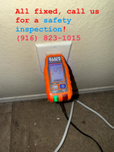 An electrician's outlet tester showing a correct 120 VAC reading during a safety inspection by AO Electric Inc. in Sacramento, CA.
