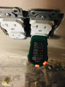 An electrical outlet tester showing correct wiring at a job site for Granados Electric LLC in Chandler, AZ.