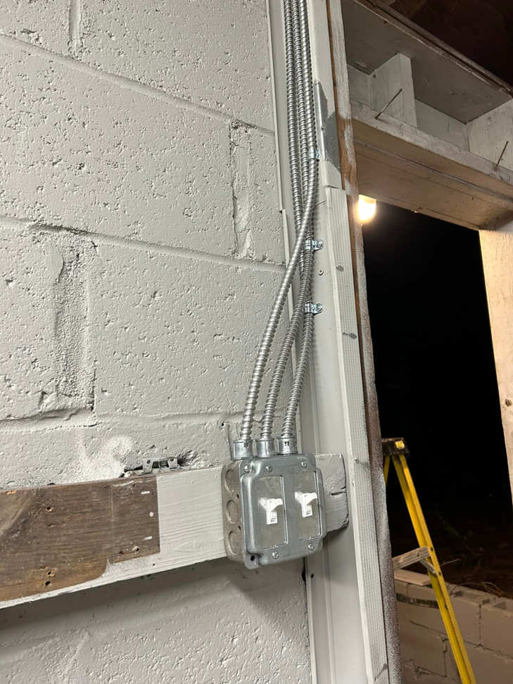 An electrician testing an electrical outlet with a receptacle tester by Ele Hvac Solutions Inc. in Birmingham, AL