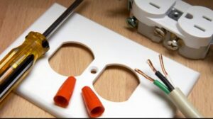 Electrical outlet components, wiring, and tools laid out for installation or repair by My A Plus Electric SA in San Antonio, TX