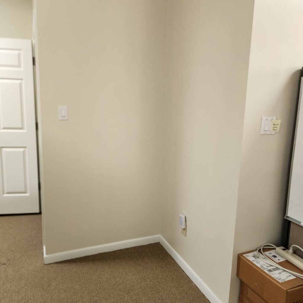 Interior view of a room showing electrical outlets and light switches installed by True Vine Electric in Raleigh, NC