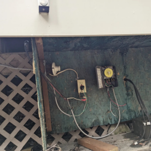 New electrical outlets, a timer, and conduit installed under a deck by Alt Electric LLC in Federal Way, WA.