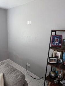 Installed electrical outlets and wiring for a TV mount on a wall by LE Electric in Las Cruces, NM