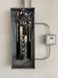 An open electrical panel with a Leviton meter, showcasing expert electrical work by Wisdom Electrical in San Francisco, CA.