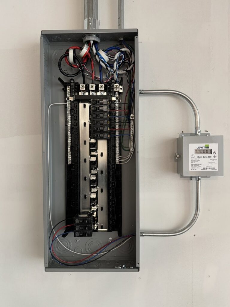 An open electrical panel with a Leviton meter, showcasing expert electrical work by Wisdom Electrical in San Francisco, CA.
