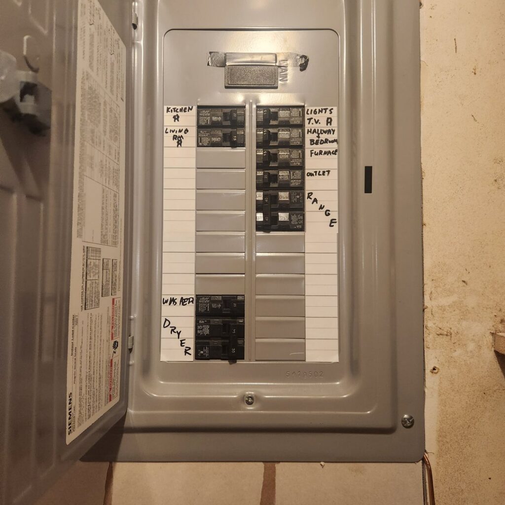 An open electrical panel with labeled circuit breakers, serviced by Next Level Contracting LLC in Dayton, OH