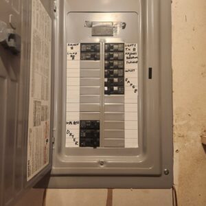 An open electrical panel with labeled circuit breakers, serviced by Next Level Contracting LLC in Dayton, OH