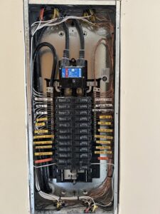 A neatly wired and labeled electrical panel or breaker box, showcasing work by Heritage Electric LLC in Indianapolis, IN.