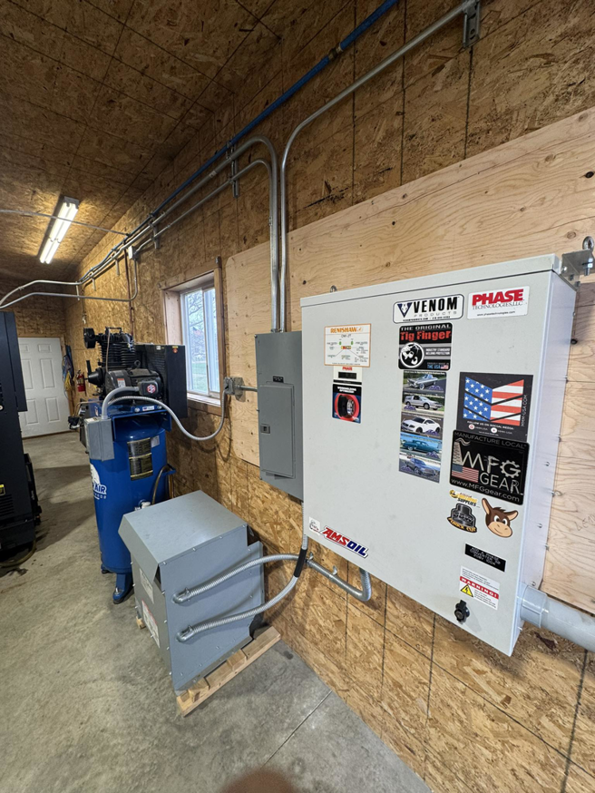 Electrical panel and conduit installation in a workshop by Black Electric & Sound in Minot, ND.