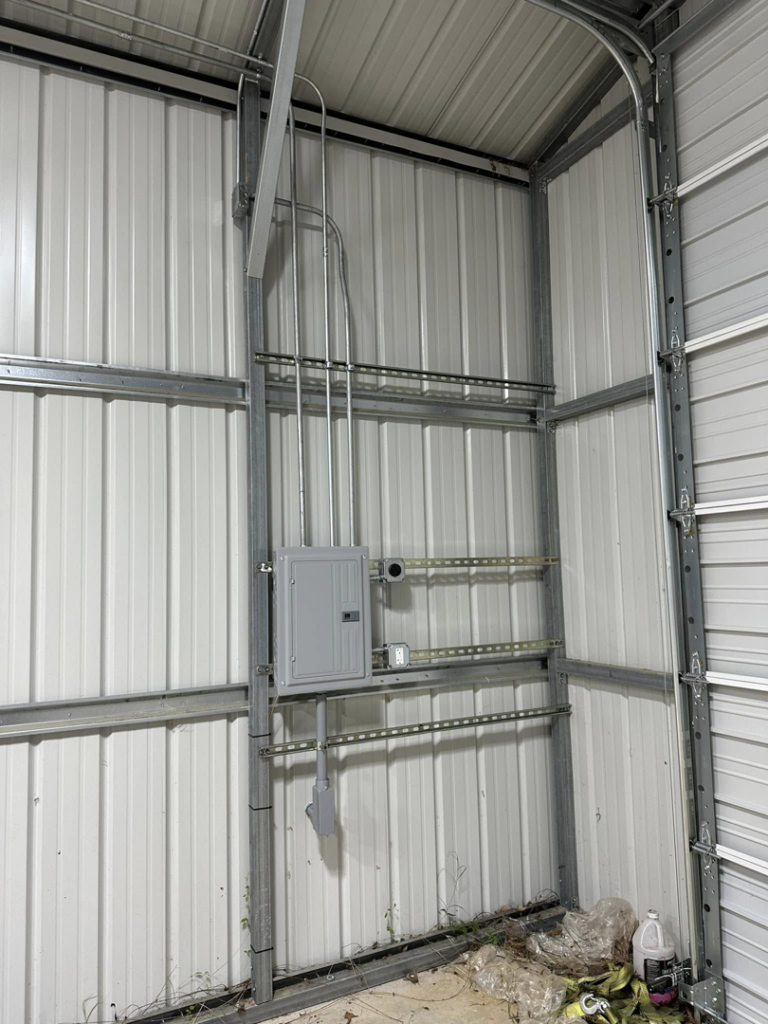 Close-up of an electrical panel and conduit installation by Current Solutions Electric in Boca Raton, FL