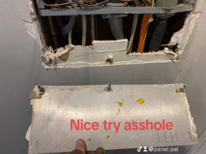 An electrical panel with its cover removed, showing exposed wiring during service by The Panel Pal in Bethlehem, GA.