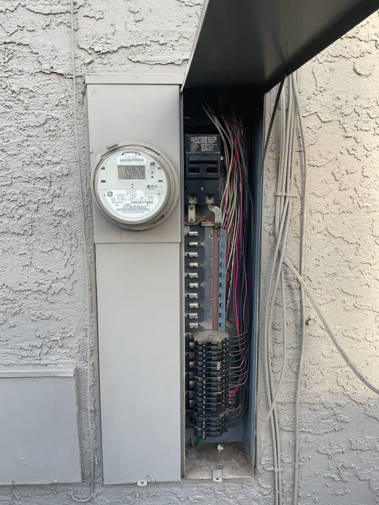An open electrical panel and meter box showing wiring and breakers, indicating an inspection or upgrade by AAA Electrical Services in Sacramento, CA.