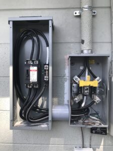 An exterior electrical panel and meter base installation by 60HZ Electric in St. Petersburg, FL.